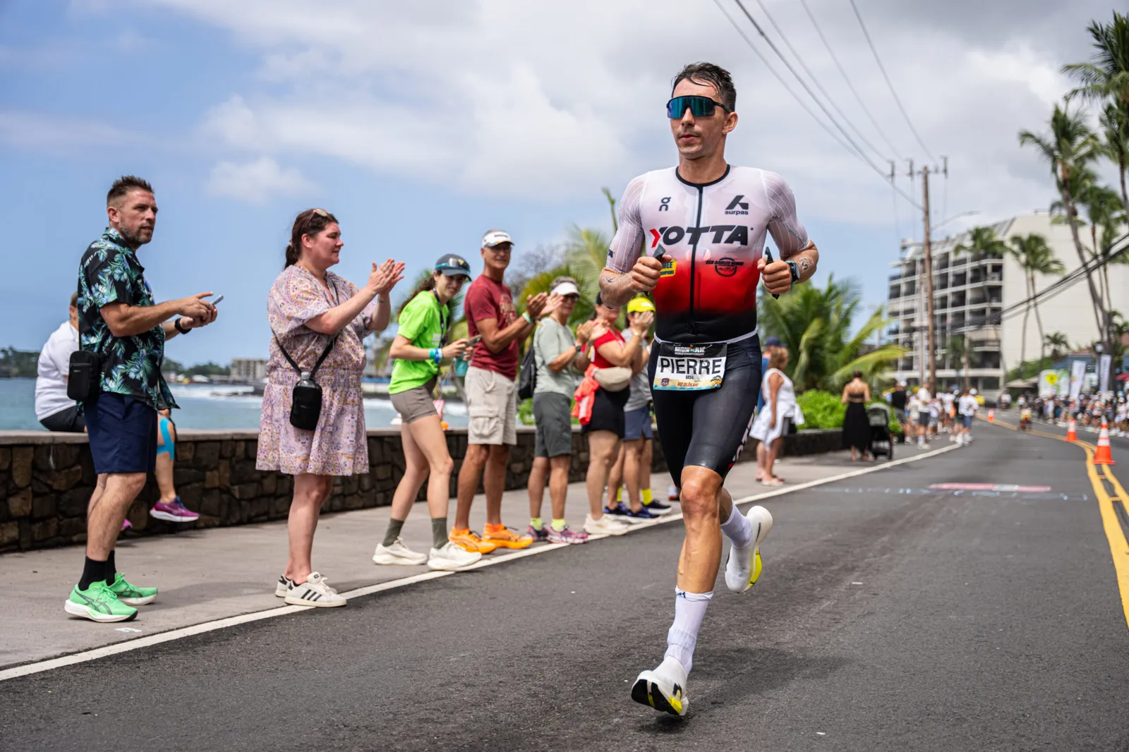 Pierre Le Corre running on Ali'i Drive during the marathon at the 2026 IRONMAN World Championship in Kona